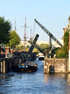 A series of locks regulates the flow of the Amstel River through the canals and into the North Sea. By the way, in 1396, the Dutch invented the first true modern lock. Called the pound lock, it uses two gates on either end of a chamber (the "pound"). Boats wait in the pound for the gates to raise or lower the water level so it matches that of the river or bay on the other side. It's a system we're intimately familiar with in Chicago, as this is how water levels get regulated for traffic coming down the Chicago River and entering Lake Michigan.