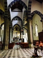 The pretty church interior contains a wooden crucifix that, on Corpus Domini (six days after Easter), gets carried down to the harbor for a service. The black-and-white-striped lancet arches are typical for Ligurian Gothic architecture.