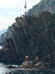 Only the young are brave enough to dive from the steep harborside cliffs.